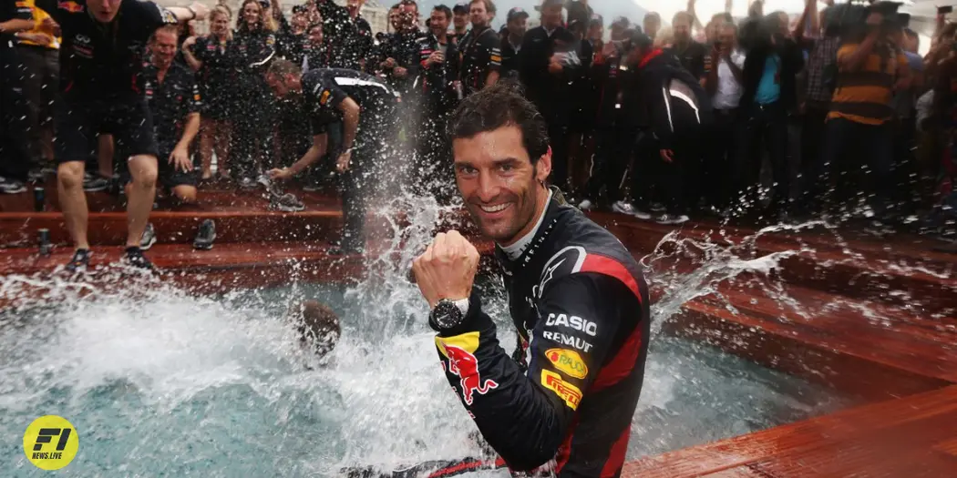 Webber taking a post-race dip celebrating Red Bull's third consecutive Monaco triumph in 2012