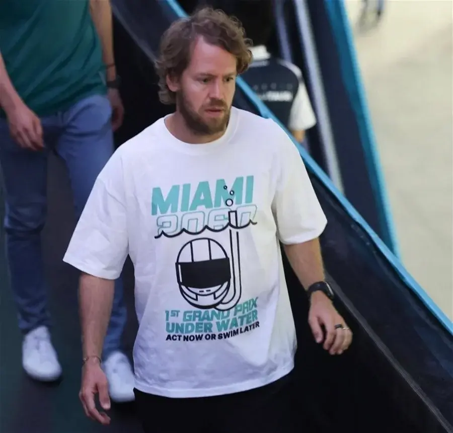 Sebastian Vettel wearing the shirt "Miami 2060 – 1st Grand Prix Underwater – Act Now or Swim Later" during the 2022 Maimi GP