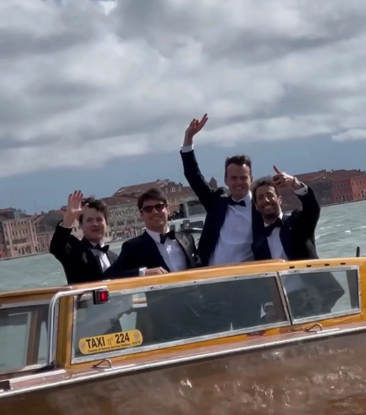 Lance Stroll and Daniel Ricciardo on a boat in Venice during the wedding Chloe Stroll