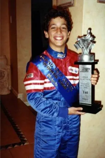 A young Ricciardo all smiles after coming First place in a Kart race 