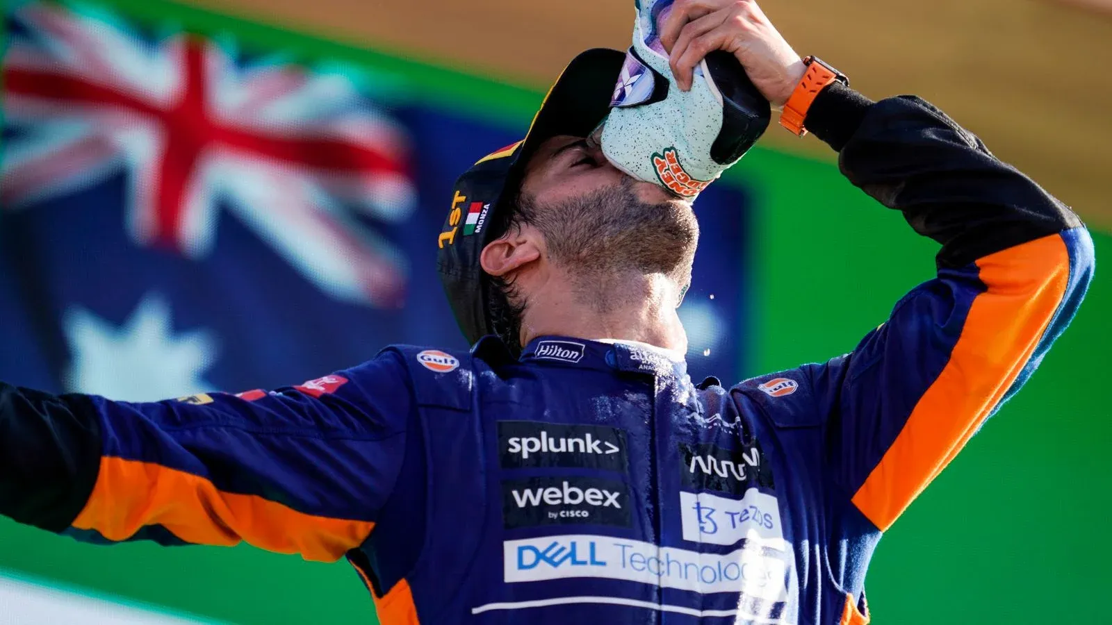 Daniel Ricciardo doing his signature celebration in the podium from his shoe, at the 2021 Italian Grand Prix (Image Credit: Sky Sports)