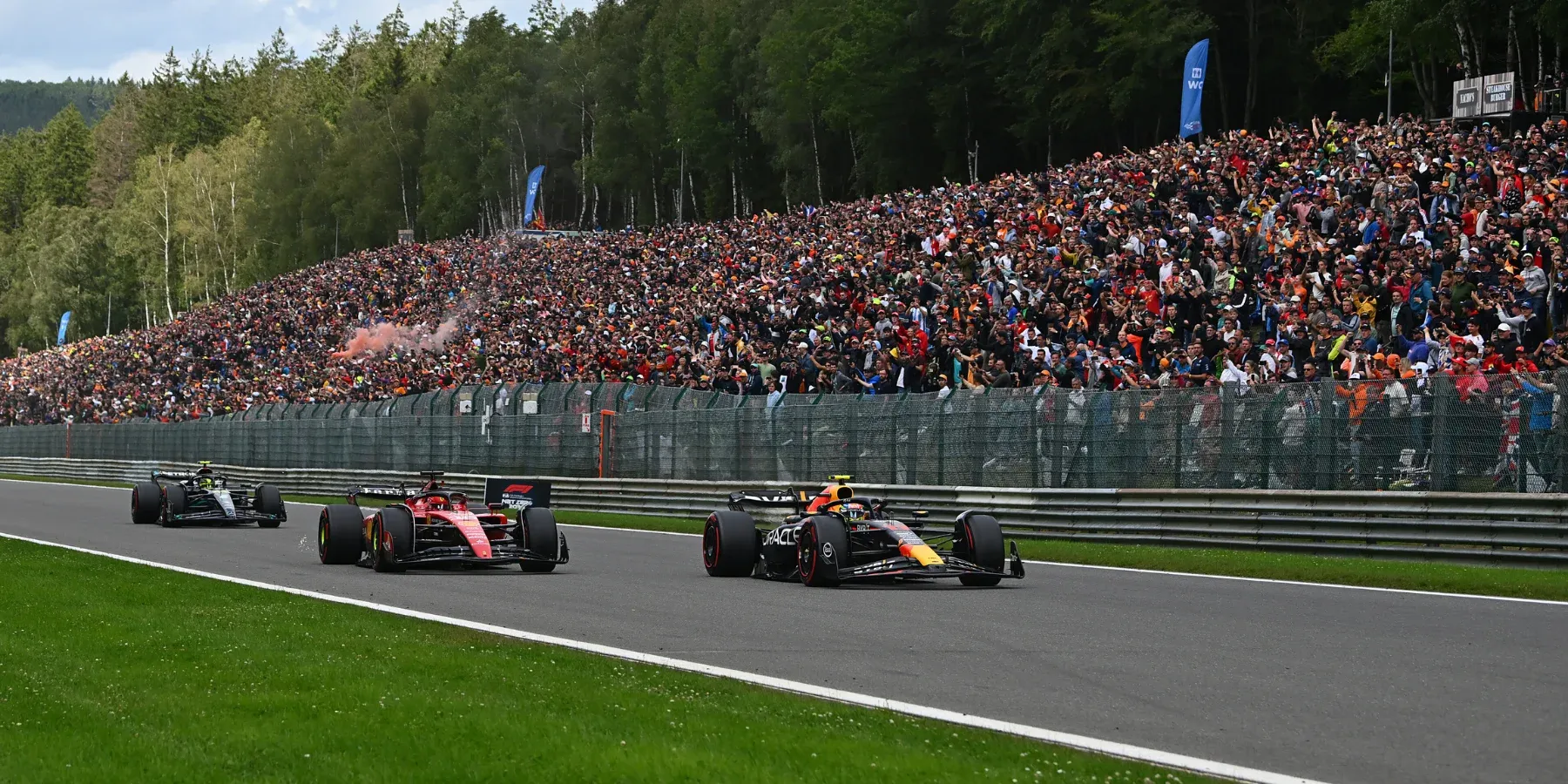 Sergio Perez overtaking Charles Leclerc on lap 1 at the 2023 Belgium Grand Prix-Red Bull Content Pool