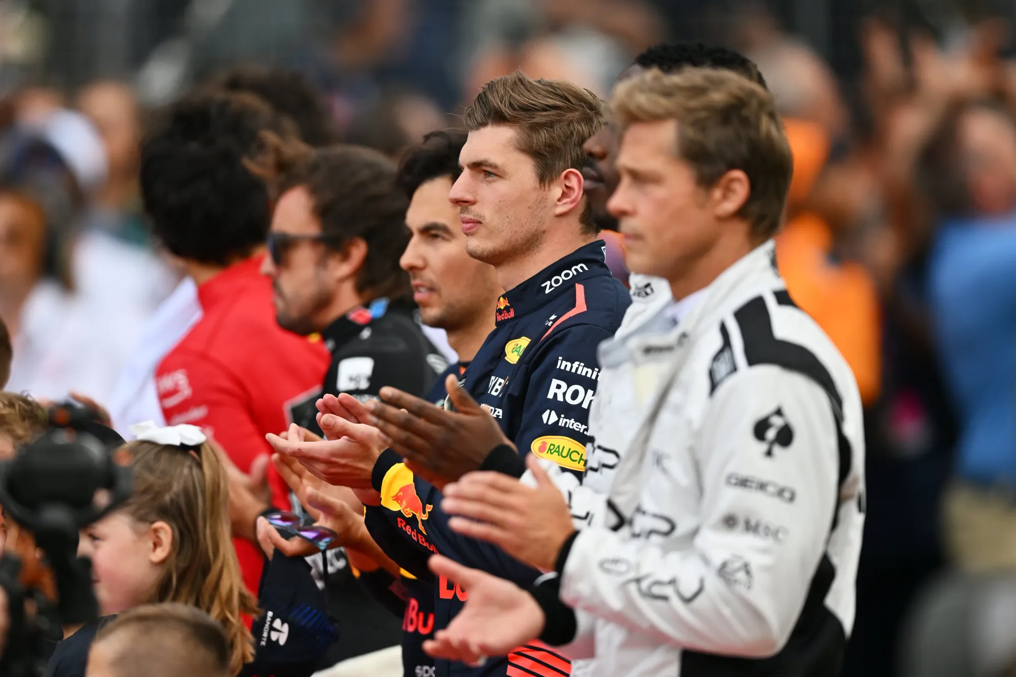 Brad Bitt, Max Verstappen, Sergio Perez during the national anthem ceremony at the 2023 British Grand Prix-Credit: Red Bull Content Pool 