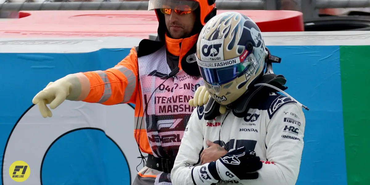 Daniel Ricciardo holding his broken hand as he exited from his car in FP2 at the 2023 Dutch GP -F1