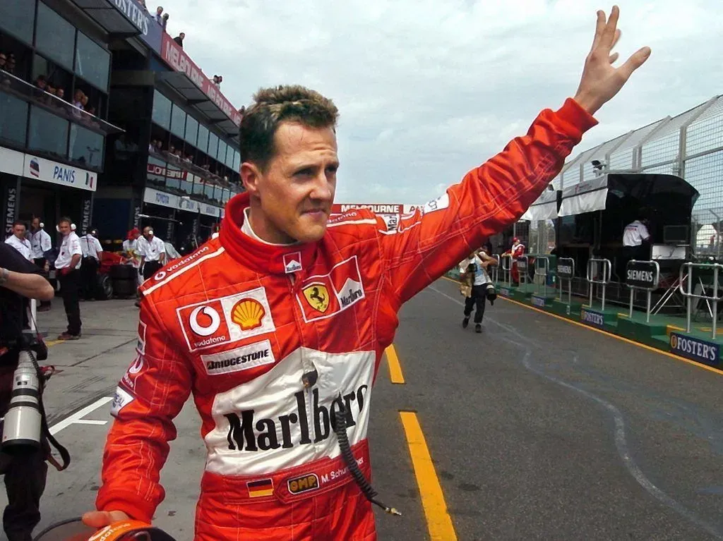 Schumacher waves to the crowd after qualifying on pole at the 2004 Australian Grand Prix