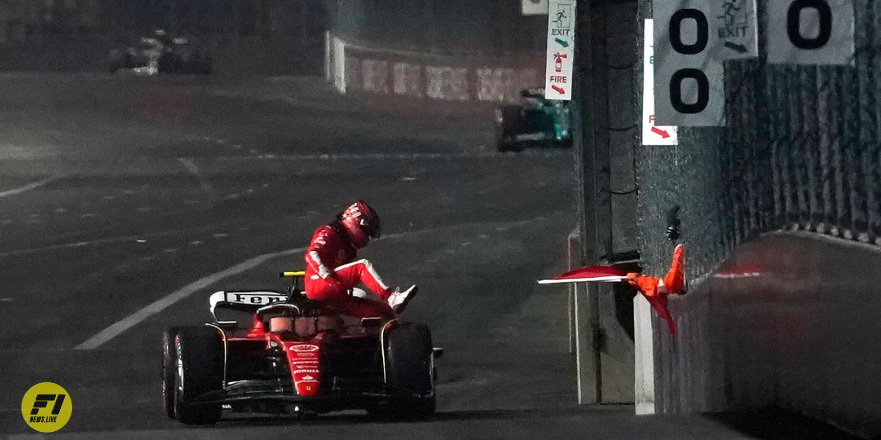 Carlos Sainz climbs out of his Ferrari