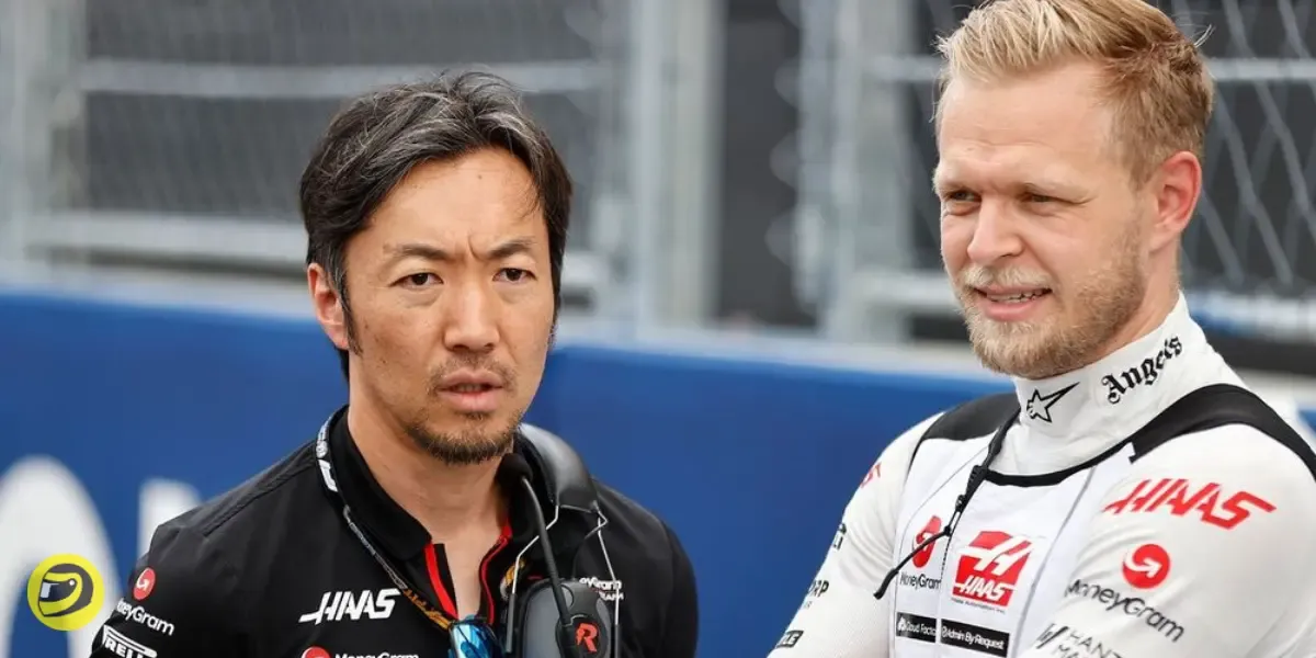 Haas team principal Ayao Komatsu and Kevin Magnussen