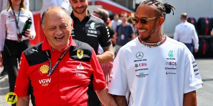 Fred Vasseur and Lewis Hamiltin walking in the paddock